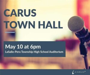 Microphone close-up on stage with text: "Carus Town Hall, May 10 at 6pm, LaSalle-Peru Township High School Auditorium." Logo at the bottom right corner.