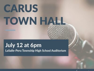 Image showing a microphone with text: "CARUS TOWN HALL. July 12 at 6pm. LaSalle-Peru Township High School Auditorium." Logo at the bottom right corner.